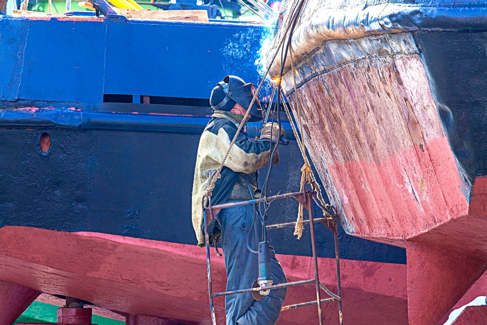 a welder working on a repair ship on Kamchatka
